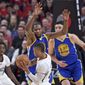 Golden State Warriors forward Kevin Durant, top, defends against Portland Trail Blazers guard Damian Lillard during the first half of Game 4 of an NBA basketball first-round playoff series, Monday, April 24, 2017, in Portland, Ore. (AP Photo/Craig Mitchelldyer)