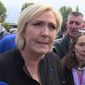 Far-right French presidential candidate Marine Le Pen is greeted by workers outside a whirlpool home appliance factory in Amiens, France, Wednesday April 26, 2017.   While her centrist presidential opponent Macron was meeting with union leaders from the Whirlpool plant in northern France, Le Pen popped up outside the factory itself, amid its workers and declared herself the candidate of France&#39;s workers.(AP Photo)