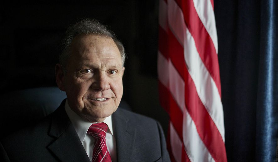 FILE - In this Feb. 17, 2015, file photo, Alabama Chief Justice Roy Moore poses for a photo in Montgomery, Ala. Moore scheduled a news conference Wednesday, April 26, 2017, on the steps of the Alabama Capitol to announce his plans for the future. (AP Photo/Brynn Anderson, File)