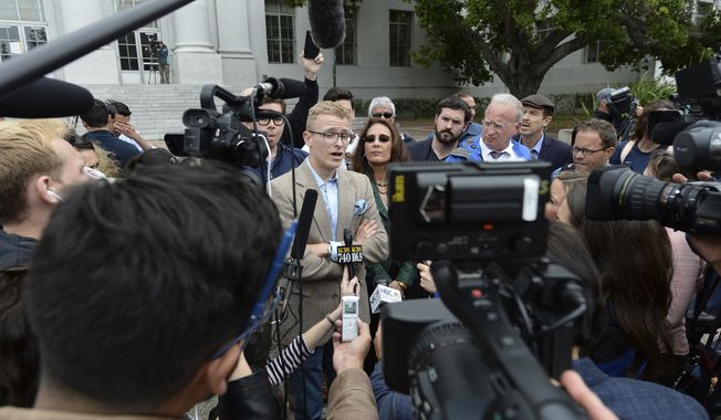 Troy Worden, left, president of the Young Republicans and their attorney Harmeet Dhillon, right, talk with the media during a press conference held by the Berkeley College Republicans in Sproul Plaza on the University of California, Berkeley campus in Berkeley, Calif., on Wednesday, April 26, 2017. The event was held to discuss the cancellation of speaker Ann Coulter&#x27;s appearance on campus. (Dan Honda/East Bay Times via AP)