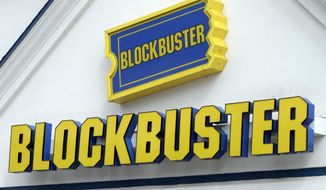 FILE - In this Sept. 22, 2010, file photo, a Blockbuster sign on a store is seen in Barre, Vt. The parents of an autistic Texas man recreated a Blockbuster for their son at their home after the story he visited twice a week closed on April 23, 2017. (AP Photo/Toby Talbot, File)