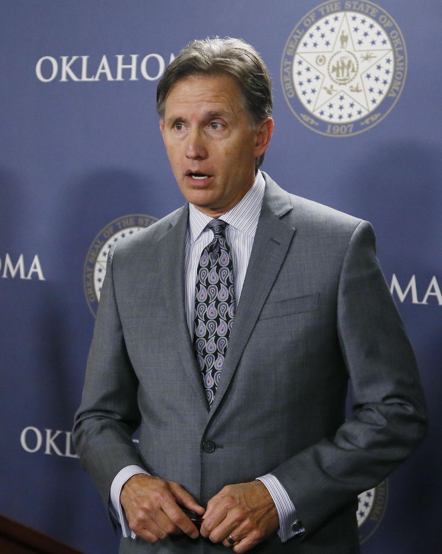 Mike Hunter, Oklahoma Attorney General, speaks during a news conference in Oklahoma City, Wednesday, April 26, 2017. Hunter said the state is moving forward with new protocols for executing death row inmates, despite a unanimous recommendation from a bipartisan study group that a death penalty moratorium remain in place. (AP Photo/Sue Ogrocki)