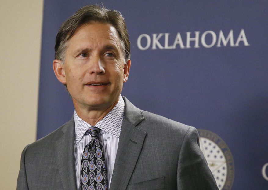 Mike Hunter, Oklahoma Attorney General, speaks during a news conference in Oklahoma City, Wednesday, April 26, 2017. Hunter said the state is moving forward with new protocols for executing death row inmates, despite a unanimous recommendation from a bipartisan study group that a death penalty moratorium remain in place. (AP Photo/Sue Ogrocki)