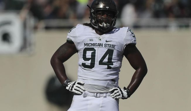 Michigan State defensive end Auston Robertson stands on the field during the Spring Game at Spartan Stadium, Saturday, April 1, 2017 in East Lansing, Mich. The former defensive end has been jailed in Indiana on a third-degree criminal sexual conduct charge filed in Michigan. (Kirthmon F. Dozier/Detroit Free Press via AP)