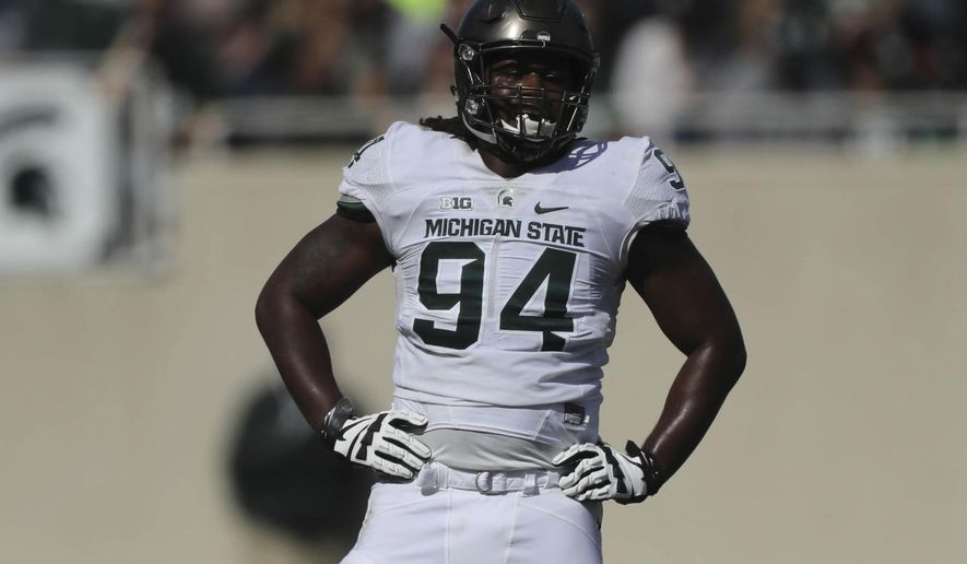 Michigan State defensive end Auston Robertson stands on the field during the Spring Game at Spartan Stadium, Saturday, April 1, 2017 in East Lansing, Mich. The former defensive end has been jailed in Indiana on a third-degree criminal sexual conduct charge filed in Michigan. (Kirthmon F. Dozier/Detroit Free Press via AP)