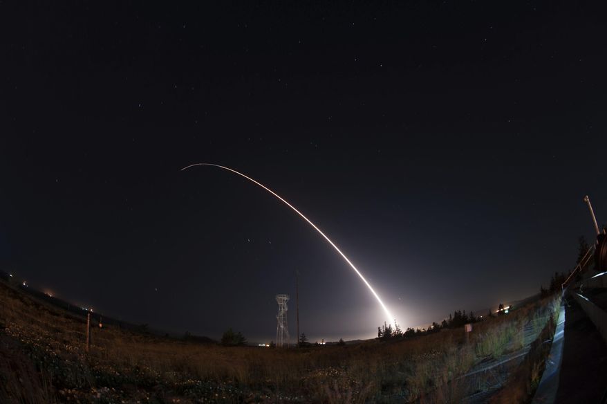 In this image taken with a slow shutter speed and provided by the U.S. Air Force, an unarmed Minuteman 3 intercontinental ballistic missile launches during an operational test early Wednesday, April 26, 201,  from Vandenberg Air Force Base, Calif. The target of the test was in the Pacific Ocean. An Air Force statement said the mission was part of a program to test the effectiveness, readiness, and accuracy of the weapon system. (Michael Peterson/U.S. Air Force via AP)