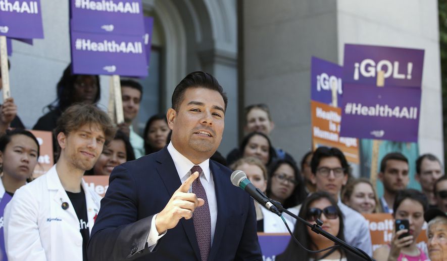 FILE - In this May 16, 2016, file photo, California state Sen. Ricardo Lara, D-Bell Gardens, speaks at a rally at the Capitol in Sacramento, Calif. California lawmakers are considering an audacious proposal that would substantially remake the state's health care system by eliminating insurance companies and guaranteeing coverage for everyone. Lara, who wrote the bill with Democratic Sen. Toni Atkins of San Diego, says they're working on details. (AP Photo/Rich Pedroncelli, File)