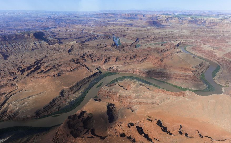 FILE - This May 23, 2016, file photo, shows the northernmost boundary of the proposed Bears Ears region, along the Colorado River, in southeastern Utah. President Donald Trump signed an executive order Wednesday, April 26, 2017, directing his interior secretary to review the designation of dozens of national monuments on federal lands, as he singled out "a massive federal land grab" by the Obama administration. (Francisco Kjolseth/The Salt Lake Tribune via AP file, File)