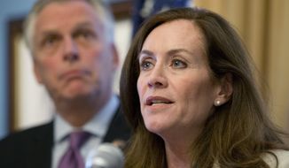 Dorothy McAuliffe, wife of Virginia Gov. Terry McAuliffe (left), speaks during a news conference at the Capitol in Richmond, Va., on Jan. 10, 2017. (Associated Press) **FILE**