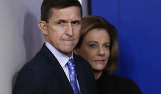 FILE - In this Feb. 1, 2017 file photo, then-National Security Adviser Michael Flynn, joined by K.T. McFarland, deputy national security adviser, watches the daily news briefing at the White House in Washington. Documents released by lawmakers show Flynn, now former national security adviser, was warned when he retired from the military in 2014 not to take foreign money without &quot;advance approval&quot; by Pentagon authorities.  (AP Photo/Carolyn Kaster, File)