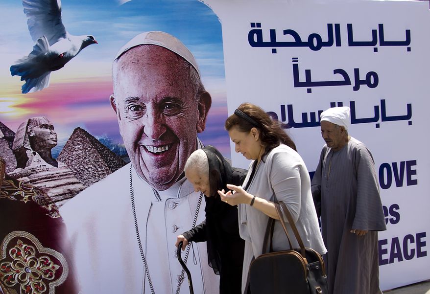 A billboard welcomes Pope Francis, at St. Mark&#39;s Cathedral in Cairo, Egypt, Thursday, April 27, 2017. On Friday, Francis is scheduled to begin a two-day pilgrimage to Egypt aimed at lifting the spirits of Christians in the Middle East, whose numbers have rapidly dwindled in recent decades due to war, displacement and emigration. The visit will include a meeting with Egypt&#39;s president and the Grand Imam of Al-Azhar as well as a Mass in a stadium on the outskirts of Cairo. (AP Photo/Amr Nabil)