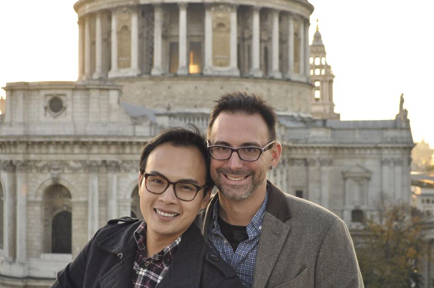 ADVANCE FOR MONDAY MAY 1 AND THEREAFTER - This 2015 photo provided by Kevin Ma shows Bobby Duong, left, and Christopher Koontz in front of St. Paul's Cathedral in London. The overall number of U.S. adoptions has dropped significantly in recent years, straining the viability of many adoption agencies and drawing some into conduct that authorities describe as unethical or worse. Would-be adoptive parents confront the specter of long waiting times and high fees. And many face pressure, as Duong and Kooontz did, to spend lavishly on self-promotional advertising if they want to compete for a chance to adopt an infant. (Kevin Ma via AP)