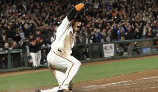 San Francisco Giants&#39; Gorkys Hernandez celebrates after scoring the winning run against the Los Angeles Dodgers during the 10th inning of a baseball game in San Francisco, Wednesday, April 26, 2017. The Giants won 4-3. (AP Photo/Jeff Chiu)