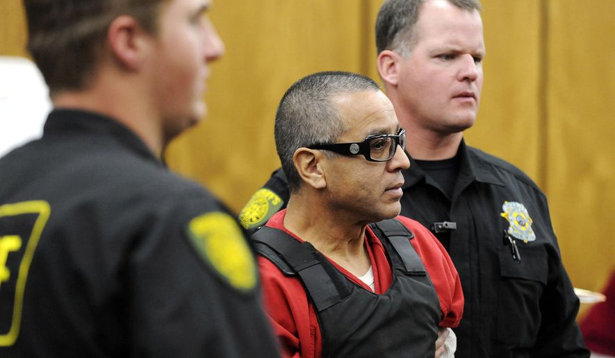 FILE - In this Nov. 17, 2011, file photo, Vagos motorcycle gang member Ernesto Gonzalez is led from district court in Reno, Nev., after pleading guilty in the shooting death of Hells Angels member Jeffrey Pettigrew. Gary Rudnick, the star witness who helped convict the triggerman, Gonzalez, who killed a high-ranking Hells Angels' boss at a Nevada casino in 2011 said he was lying when he testified that the shooting was an assassination plot orchestrated by a rival motorcycle gang, according to documents obtained by The Associated Press. Gonzalez is scheduled to be tried again in August 2017 after his conviction was tossed on a technicality. (David B.Parker/The Reno Gazette-Journal via AP, Pool, File)
