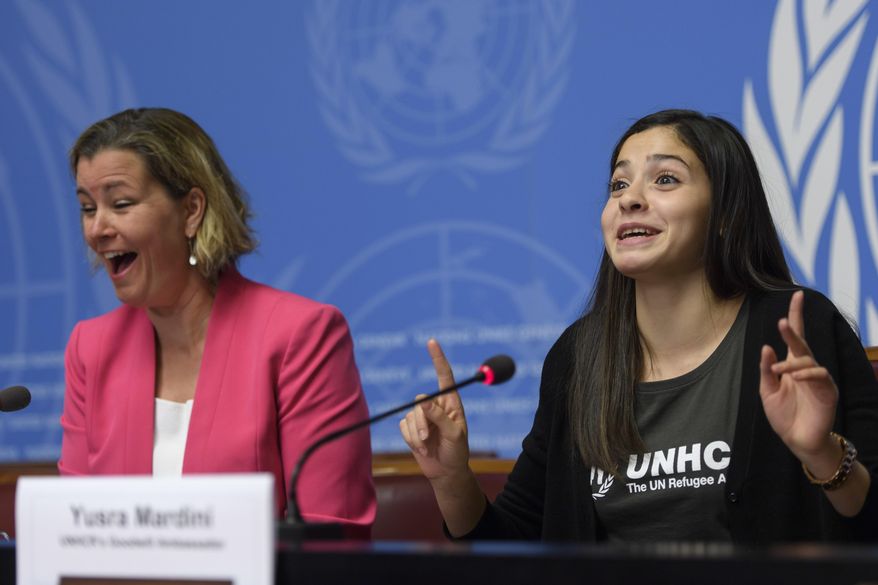 Kelly T. Clements, left, United Nations Deputy High Commissioner for Refugees, left, laughs as Syrian refugee and Olympic athlete Yusra Mardini, newly appointed UNHCR's Goodwill Ambassador, speaks to the media about her appointment as UNHCR's Goodwill Ambassador, during a press conference, at the European headquarters of the United Nations in Geneva, Switzerland, Thursday, April 27, 2017. (Martial Trezzini/Keystone via AP)