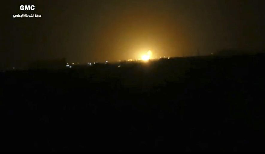This frame grab from video provided by the Syrian anti-government activist group Ghouta Media Center, which has been authenticated based on its contents and other AP reporting, shows flames rising after an explosion near an airport west of Damascus, Syria, Thursday, April 27, 2017. Syria&#x27;s state media reported Thursday that Israel has attacked a military installation near the Damascus International Airport. SANA says Israel fired several missiles from inside the occupied Golan Heights south of the capital at a military installation near the capital&#x27;s main airport, triggering several explosions and causing damage. (Ghouta Media Center via AP)
