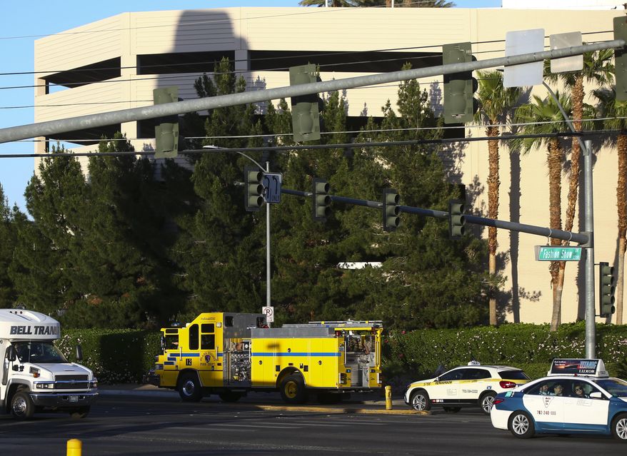 A Clark County Fire Department fire engine leaves the Trump International after two separate fires were started at the hotel in Las Vegas on Wednesday, April 26, 2017. Fire officials say one person is injured and a suspect is in custody after two separate blazes were discovered at the Trump International Hotel in Las Vegas.The Clark County Fire Department released a statement saying toasters, towels and various other materials were used to ignite the fires at the hotel bearing President Donald Trump’s name. (Chase Stevens/Las Vegas Review-Journal via AP)
