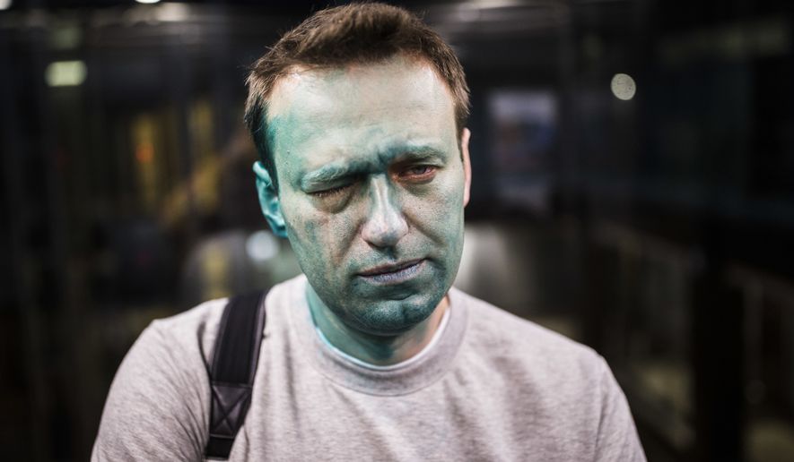 In this photo taken on Thursday, April 27, 2017, Russian opposition leader Alexei Navalny poses for a photo after unknown attackers doused him with green antiseptic outside a conference venue in Moscow, Russia. Navalny, who authored a documentary about the Russian prime minister&#39;s alleged corrupt wealth that was viewed more than 20 million times online, was the key force behind nationwide anti-government rallies in March, Russia&#39;s largest and most widespread in years. (Evgeny Feldman/Pool Photo via AP)