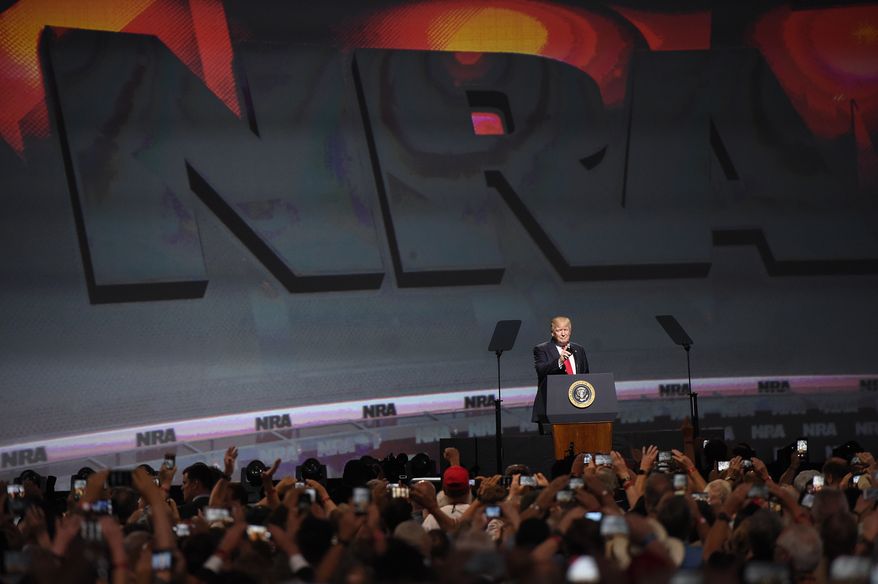 President Donald Trump speaks during the National Rifle Association-ILA Leadership Forum, Friday, April 28, 2017, in Atlanta. The NRA is holding its 146th annual meetings and exhibits forum at the Georgia World Congress Center. (AP Photo/Mike Stewart)
