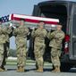 An Army carry team places a transfer case containing the remains of Army Sgt. Cameron Thomas, 23, of Kettering, Ohio, into the transfer vehicle, Friday, April 28, 2017, at Dover Air Force Base, Del. Thomas and Sgt. Joshua P. Rodgers, 22, of Bloomington, Ill, killed during a raid on an Islamic State compound in eastern Afghanistan, may have died as a result of friendly fire during the opening minutes of the fierce, three-hour firefight, the Pentagon said Friday. (AP Photo/Cliff Owen)