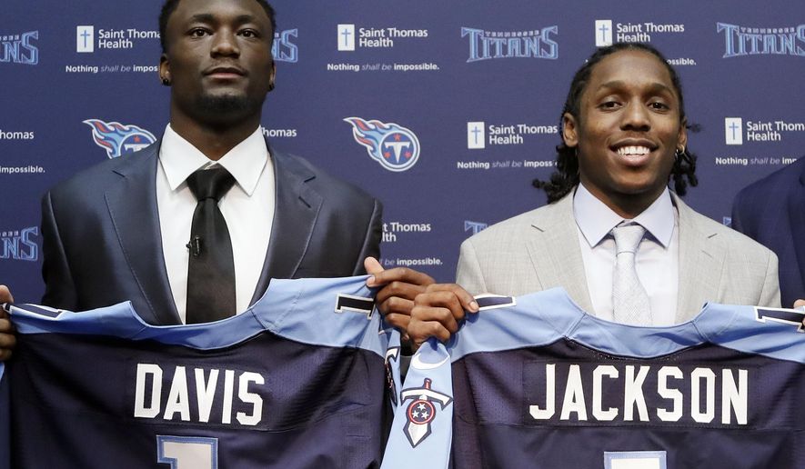 Western Michigan wide receiver Corey Davis, left, and Southern California defensive back Adoree&#x27; Jackson pose for photos as they are introduced as the Titans&#x27; top draft picks during a news conference Friday, April 28, 2017, in Nashville, Tenn. (AP Photo/Mark Humphrey)