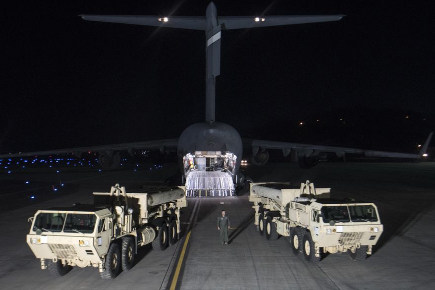 FILE - In this March 6, 2017 file photo provided by U.S. Forces Korea, trucks carrying parts of U.S. missile launchers and other equipment needed to set up Terminal High Altitude Area Defense (THAAD) missile defense system arrive at Osan air base in Pyeongtaek, South Korea. America’s top Pacific commander is confident in the ability of a contentious U.S. missile defense system soon to operate in South Korea to shoot down North Korean missiles. (U.S. Force Korea via AP, File)