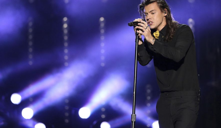 FILE - In this Nov. 22, 2015, file photo, Harry Styles of One Direction performs at the American Music Awards at the Microsoft Theater in Los Angeles. Styles announced a solo world tour on April 28, 2017, ahead of the May 12 release of his self-titled solo debut. (Photo by Matt Sayles/Invision/AP, File)