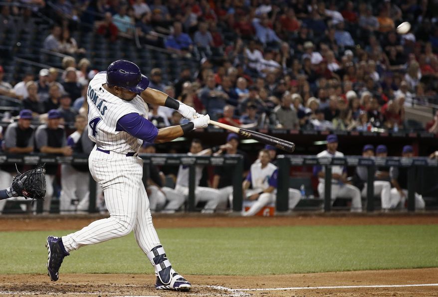 Arizona Diamondbacks' Yasmany Tomas swings for a two-run home run against the San Diego Padres during the fourth inning of a baseball game Thursday, April 27, 2017, in Phoenix. (AP Photo/Ross D. Franklin)