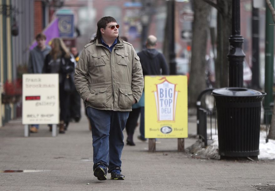 ADVANCE FOR USE MONDAY, MAY 1, 2017 AND THEREAFTER-In this Feb. 24, 2017 photo, Chaz Wing walks down Maine Street in Brunswick, Maine. Wing has testified that he was raped by other kids three times in his first year in junior high, even after repeatedly complaining of harassment to teachers and administrators. Chaz’s saga is more than a tale of escalating bullying. Across the U.S., thousands of students have been sexually assaulted, by other students, in high schools, junior highs and even elementary schools _ a hidden horror educators have long been warned not to ignore. (AP Photo/Robert F. Bukaty)