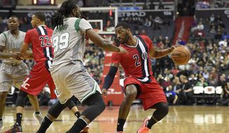 John Wall, with ball, and Jae Crowder have a feisty on-court history. / AP images