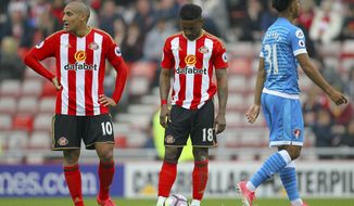 Sunderland&#x27;s Wahbi Khazri, left, and Sunderland&#x27;s Jermain Defoe show their dejection as their side concede during their English Premier League soccer match against AFC Bournemouth at the Stadium of Light, Sunderland, England, Saturday, April 29, 2017. (Richard Sellers/PA via AP)