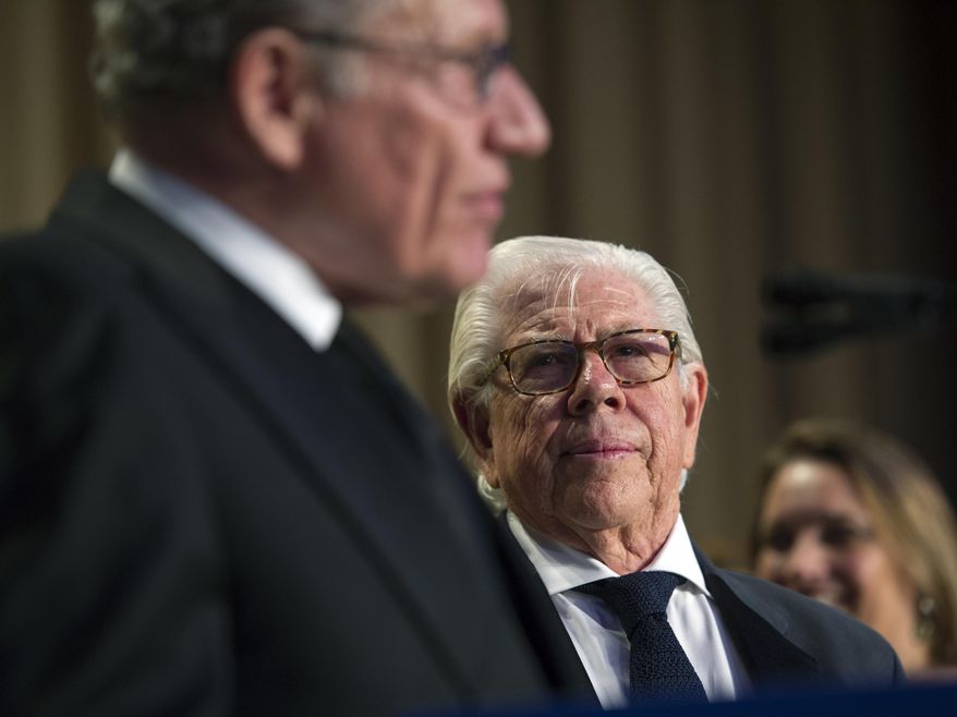 Journalist and author Carl Bernstein looks at journalist and author Bob Woodward as they address the White House Correspondents' Dinner in Washington, Saturday, April 29, 2017. (AP Photo/Cliff Owen)