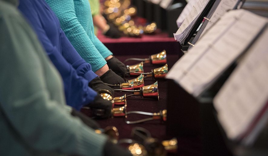 ADVANCE FOR WEEKEND EDITIONS, APRIL 29-30 - In this Thursday, April 13, 2017 photo, members of the handbell choir are pictured during practice at Salmon Creek United Methodist Church in Vancouver, Wash. (Amanda Cowan/The Columbian via AP)