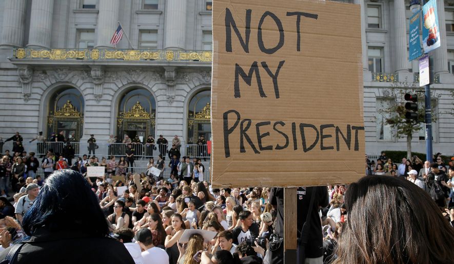 High school students protest in opposition of Donald Trump&#x27;s presidential election victory in front of City Hall in San Francisco, Thursday, Nov. 10, 2016. (AP Photo/Eric Risberg) (credit)