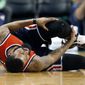 Washington Wizards&#39; Markieff Morris holds his leg during the second quarter of a second-round NBA playoff series basketball game against the Boston Celtics, Sunday, April, 30, 2017, in Boston. (AP Photo/Michael Dwyer)