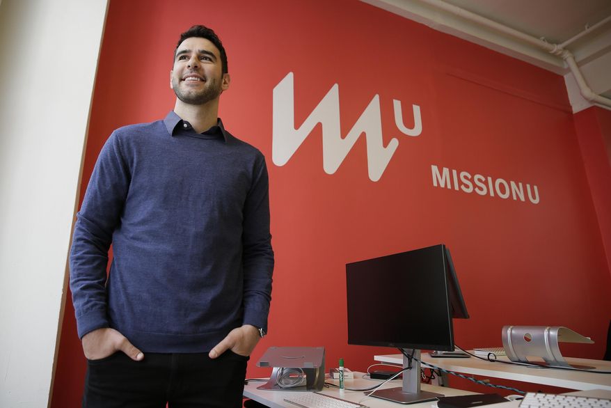 In this photo taken April 27, 2017, founder Adam Braun poses at MissionU in San Francisco. MissionU, which began accepting its first applications last month, offers a one-year program in data analytics and business intelligence with an upfront tuition of $0. As part of a profit-sharing agreement, MissionU students will be giving back 15 percent of their salary for three years after graduation, given that they make at least $50,000 per year. (AP Photo/Eric Risberg)