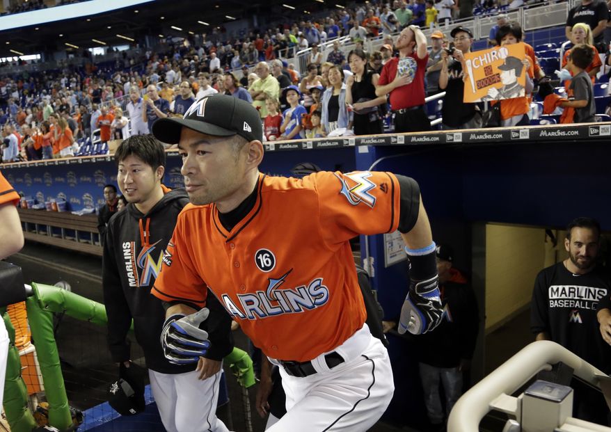 Miami Marlins' Ichiro Suzuki runs from the dugout after a pregame ceremony honoring his 3,000th career hit before a baseball game against the Pittsburgh Pirates, Sunday, April 30, 2017, in Miami. (AP Photo/Lynne Sladky)