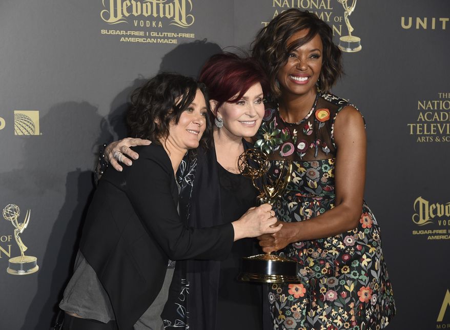 Sara Gilbert, from left, Sharon Osbourne and Aisha Tyler, winners of the award for outstanding entertainment talk show for "The Talk," pose in the press room at the 44th annual Daytime Emmy Awards at the Pasadena Civic Center on Sunday, April 30, 2017, in Pasadena, Calif. (Photo by Richard Shotwell/Invision/AP)
