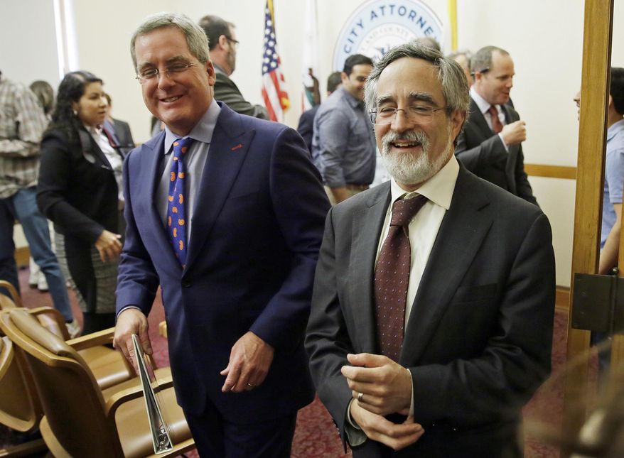 City Attorney Dennis Herrera, left, smiles while walking with San Francisco Supervisor Aaron Peskin, right, after announcing a settlement agreement on short term rentals during a news conference Monday, May 1, 2017, at City Hall in San Francisco. San Francisco and Airbnb have reached a deal to end a lawsuit over a law that fines the company for booking rentals not registered with the city. (AP Photo/Eric Risberg)