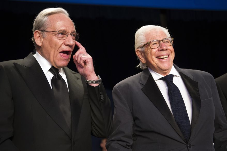 Bob Woodward, left, talks with Carl Bernstein during the White House Correspondents' Dinner in Washington, Saturday, April 29, 2017. (AP Photo/Cliff Owen)