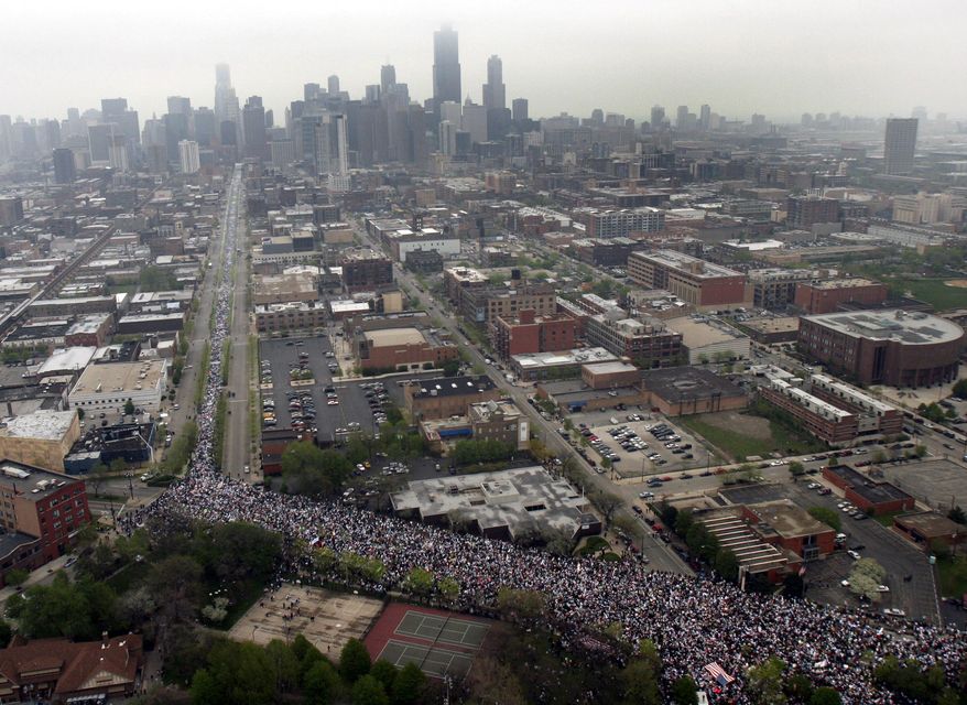 FILE - In this May 1, 2006, file photo more than 300,000 demonstrators march to show support for immigrant rights in Chicago. Immigrant and union groups will march in cities across the United States on Monday, May 1, 2017, to mark May Day and protest against President Donald Trump’s efforts to boost deportations. The day has become a rallying point for immigrants in the U.S. since demonstrations were held in 2006 against a proposed immigration enforcement bill. (AP Photo/Jeff Roberson, File)