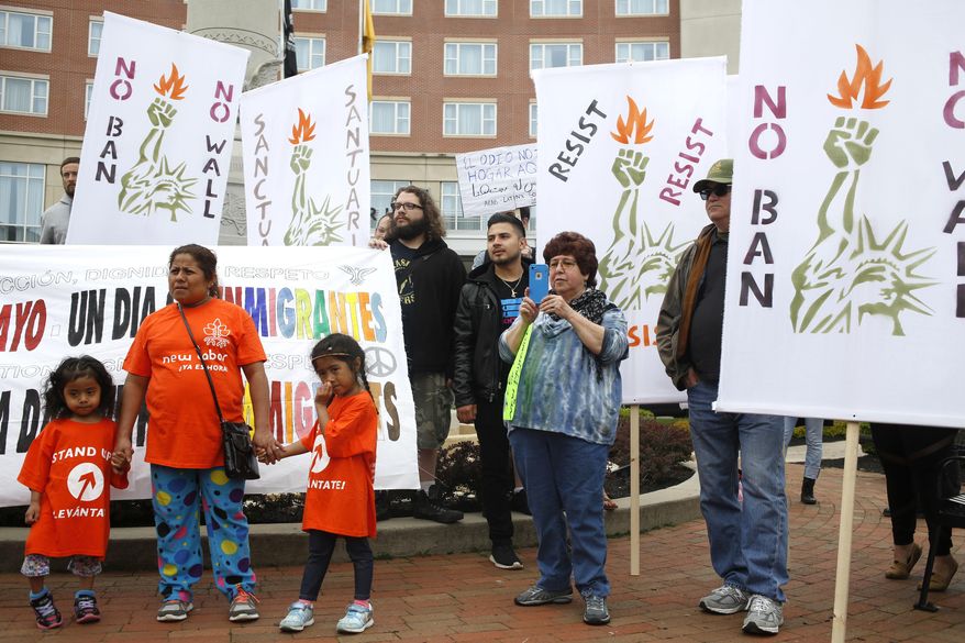 A group of people participate in a May Day rally in New Brunswick, N.J., Monday, May 1, 2017. The demonstrations on May Day, celebrated as International Workers' Day, follow similar actions worldwide in which protesters from the Philippines to Paris demanded better working conditions. In the United States, there were no reports of violence, but protesters vowed to participate in civil disruptions throughout the day to draw attention to the importance of immigrants in American communities. (AP Photo/Seth Wenig)