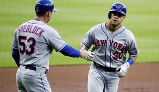 New York Mets&#39; Michael Conforto, right, is congratulated by third base coach Glenn Sherlock after hitting a home run in the first inning of a baseball game against the Atlanta Braves in Atlanta, Monday, May 1, 2017. (AP Photo/David Goldman)