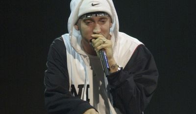 FILE - In this Nov. 14, 2002, file photo, Eminem performs at the MTV European Music Awards in Sant Jordi palace in Barcelona, Spain. They may not have lost themselves in the music or the moment but a judge and nine lawyers in a New Zealand courtroom did listen politely to Eminem’s “Lose Yourself” as a copyright trial involving the country’s ruling political party began Monday, May 1, 2017. The Detroit-based music publishers for Eminem are suing New Zealand’s conservative National Party for using a similar soundtrack titled “Eminem Esque” for a 2014 TV ad.  (AP Photo/Denis Doyle, Pool, File)