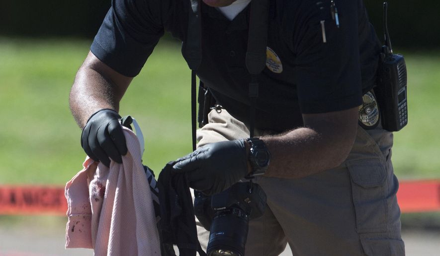 Montgomery Police investigate the shooting death of a 14-year-old student at St. James Missionary Baptist Church next to Bellingrath Middle School in Montgomery, Ala., Monday, May 1, 2017. (Albert Cesare/The Montgomery Advertiser via AP)