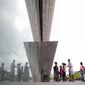 Visitors are seen reflected as they enter the Smithsonian National Museum of African American History and Cultural on the National Mall in Washington, Monday, May 1, 2017. The hottest ticket in Washington right now is for the new museum, where thousands of tickets are snapped up each month within minutes of being released, a full seven months after the museum opened. (AP Photo/Pablo Martinez Monsivais)