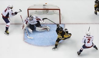 Pittsburgh Penguins&#39; Sidney Crosby (87) is knocked off balance by Alex Ovechkin (8) before taking a hit from Washington Capitals&#39; Matt Niskanen during the first period of Game 3 in an NHL Stanley Cup Eastern Conference semifinal hockey game against the Washington Capitals in Pittsburgh, Monday, May 1, 2017. Crosby left the game and did not return. The Capitals won in overtime 3-2. (AP Photo/Gene J. Puskar)