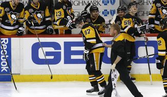 Pittsburgh Penguins&#x27; Sidney Crosby (87) is helped off the ice after being injured during the first period of Game 3 in an NHL Stanley Cup Eastern Conference semifinal hockey game against the Washington Capitals in Pittsburgh, Monday, May 1, 2017. Crosby did not return to the game and the Capitals won in overtime 3-2. (AP Photo/Gene J. Puskar)