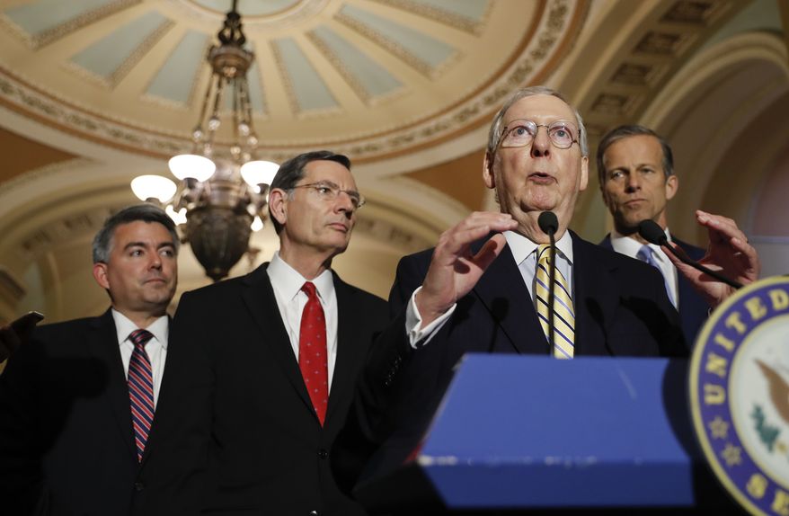 Senate Majority Leader Mitch McConnell of Ky., accompanied by, from left, Sen. Cory Gardner, R-Colo., Sen. John Barrasso, R-Wyo., and Sen. John Thune, R-S.D., speaks to reporters on Capitol Hill in Washington, Tuesday, May 2, 2017, following a policy luncheon. (AP Photo/Pablo Martinez Monsivais)