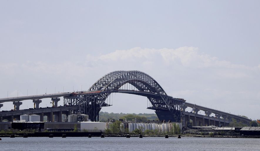 This photo shows the Bayonne Bridge prior to a news conference announcing the bridge project completion, Tuesday, May 2, 2017, seen from Elizabeth, N.J. New Jersey Gov. Chris Christie announced that as of June 30, the $1.6 billion raising of the Bayonne Bridge roadway will be completed, six months ahead of its year-end schedule. (AP Photo/Julio Cortez)